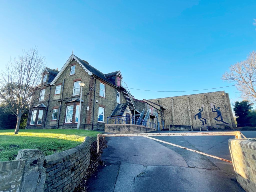 Lot: 91 - SUBSTANTIAL BUILDING WITH ATTACHED SPORTS HALL AND PARKING WITH POTENTIAL - Main photo of house and sports hall